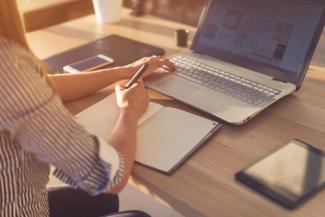 Student on laptop image Remote Proctored Exam